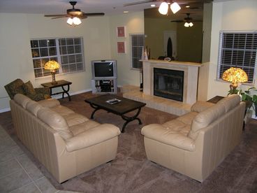 The large living room features a marble fireplace and a 32 inch TV with cable, DVD player and XBox game console.
