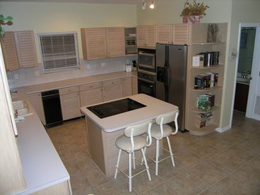 The kitchen is fully equipped with through the door ice and water fridge, oven, jenn aire stove, trash compactor and microwave.