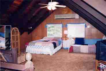 Cozy Loft has 2 beds, satellite tv, vcr, movies and desk