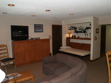 Living Room with two twin murphy beds.