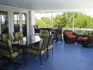 Seating for 10, or open up the French doors to the dining area inside the Main House.