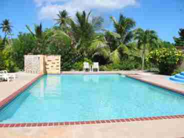 The beautiful 20x40-foot pool has a pool bar with dining area, fridge, and two grills so you can enjoy lunch or dinner right on the poolside deck.