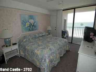 Master Suite with TV, private balcony & bath