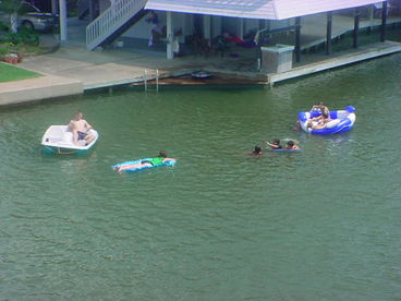 Kids having fun swimming and using our paddle boat