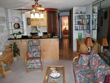 This is a photo taken after our Remodel. We put in New Natural Maple Cabinets and Black Galaxy Granite countertops. Lanai to Living Rm, Kitchen, Hall