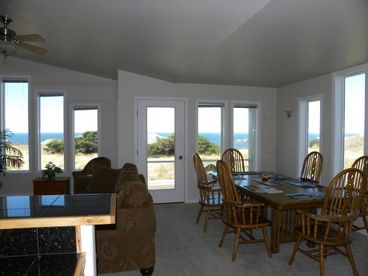 Watch the view from the kitchen, dining and living rooms. 