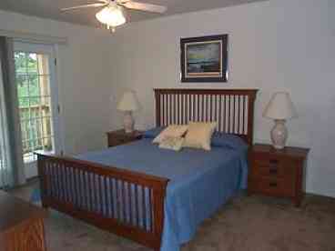 Master bedroom with french doors leading to the front, beach facing balcony.
