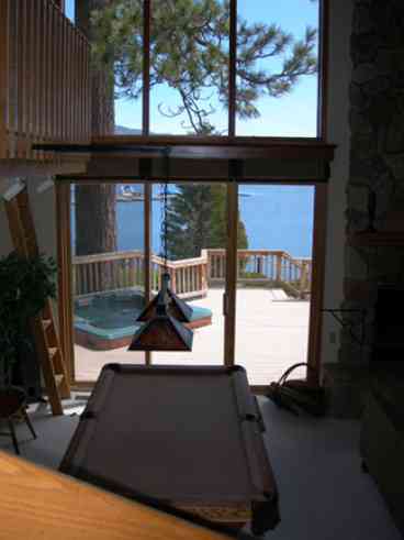 Pool table, fireplace, sitting area, wide-screen TV, DVD/VCR, surround sound.  Glass doors by pool table lead to the outside deck with large spa. All overlooking Big Bear Lake!