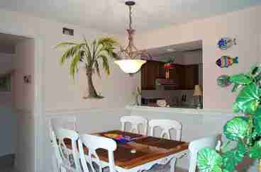 Dining room has pass thru to full kitchen equipped with everything you need.