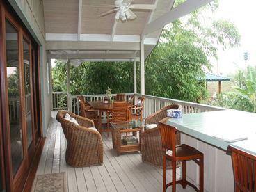 Front of house lanai with outdoor dining area