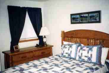 Master Bedroom with Log Furniture and Queen Bed.