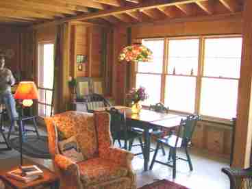 dining area opening to living room and kitchen