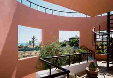 View Looking Out from Front Door of Upper Unit with view and spiral staircase to Rooftop.