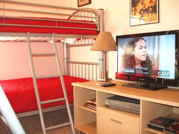 Try, just try to get the kids out of their room! TWO sets of twin-size bunk beds (4 beds) their own flat screen TV and DVD, movies, games and more!