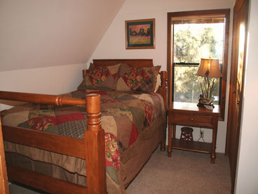 Comfortable queen bed in upstairs bedroom