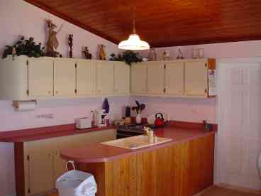 Fully equipped kitchen in Mermaid Cottage with Jennaire stove.