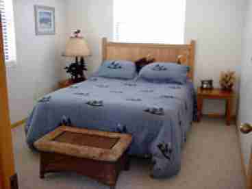 Main Floor Bedroom with Queen Bed.