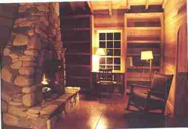 Master bedroom with roaring fire.