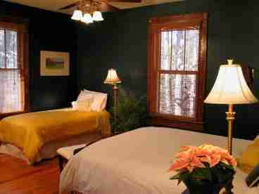 A lovely upstairs room for just $95 per night. This room shares a bath with Dogwood. The large bath features a claw-foot tub and Tiffany style chandelier.