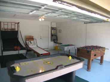 Games room with Foosball, airhockey, basketball, roll-a-score etc..