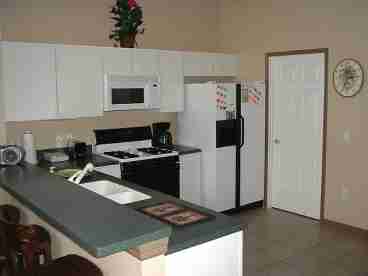 Fully applianced kitchen with dining area