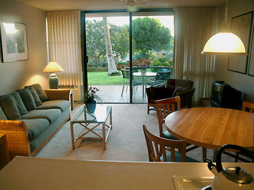 The living room opens onto your very private 13 ft. x 10 ft. tiled lanai with a glass top table and four patio chairs.