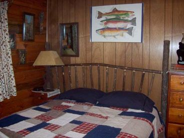 Bedroom has a queen bed and set of bunk beds.