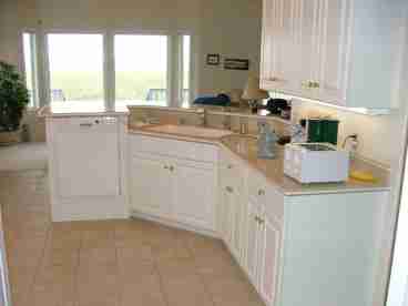Full Kitchen completely stocked with walk-in pantry, bar, and many appliances