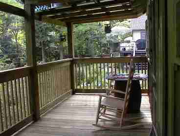 LISTEN TO THE RUSHING WHITE WATER OF THE ROCKY BROAD RIVER (ACROSS THE ROAD) FROM THE FRONT DECK