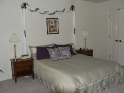 Queen size bed, dresser and walk-in large closet.  Slider to outside patio with security screen. Ceiling Fan.
