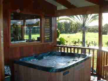 Enjoy a relaxing hot tub on the covered view lanai while looking out upon both Ocean and Mountain views.