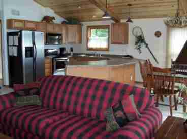 Lakewood's kitchen is fully stocked with cooking and eating utentils, full size stove and frig, microwave, and dishwasher.