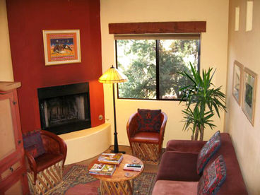 Beautifully Decorated Living Room with Corner Fireplace