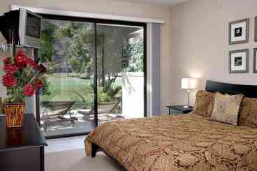 Master Bedroom with patio and stunning views of the Santa Rosa Mountains and golf course