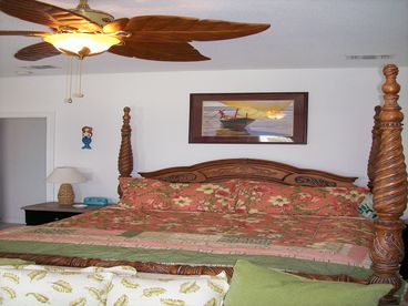 The master bedroom, with King Bed, large walk-in shower and private deck