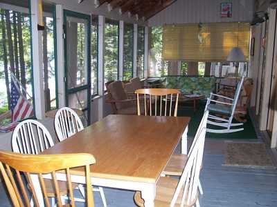 screened in porch with beautiful view of the lake