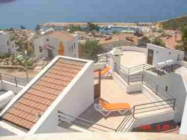 View of roof with sunbeds