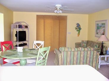 Comfortable, Spacious living area with large back deck.  Queen sleeper sofa, TV, DVD, VCR, Movies Games, books and puzzles for all ages for quiet times off the beach!