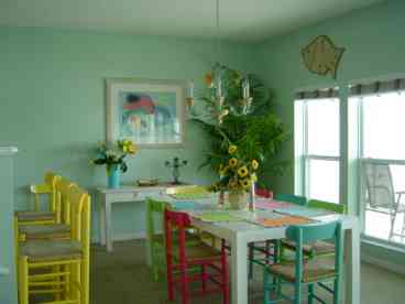 Colorful & Spacious dining room seats 8 comfortably and island bar seats 3. DR faces the ocean with full ocean views