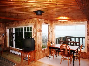 Our dining area overlooks a deck and the Pacific Ocean