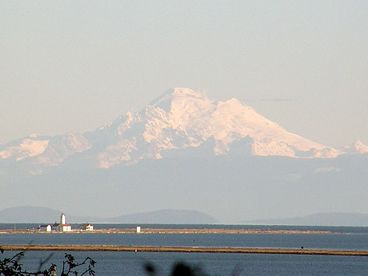 Spectacular views of Mount Baker and the historic Dungeness Lighthouse built 1857.