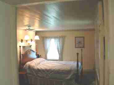 Circa 1890 Master Bedroom with original woodwork and private entrance to porch.