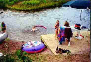 Deck and shallow area at my private pond. Pond is stocked with large trout. Shaded picnic area and fire pit nearby. Very private.