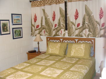 Hawaiian Room with Queen Size Bed,
 5 Drawer Bureau, Sliding Mirrored Closet Doors, large ceiling fan and portable fan.