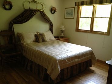 queen size bed under a crown canopy