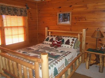 All wood furnishing throughout this cuddly cabin. Queen beds in both rooms. Master suite pictured here has private spa!