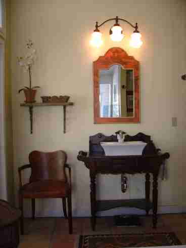 Master Bathroom with antique washbasin sink and a large shower with two shower heads