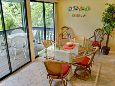 Dining with a view...dining room with sliding glass doors to the screened lanai