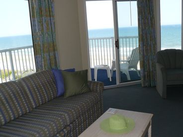 Our Oceanfront Condo has gorgeous views of the sparkling blue Atlantic from all windows, making the living room light and bright! Floor to Ceiling views from the sliding glass doors