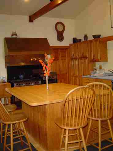 Kitchen is welcoming.  Six burner, two oven Garland stove with top griddle and grill.